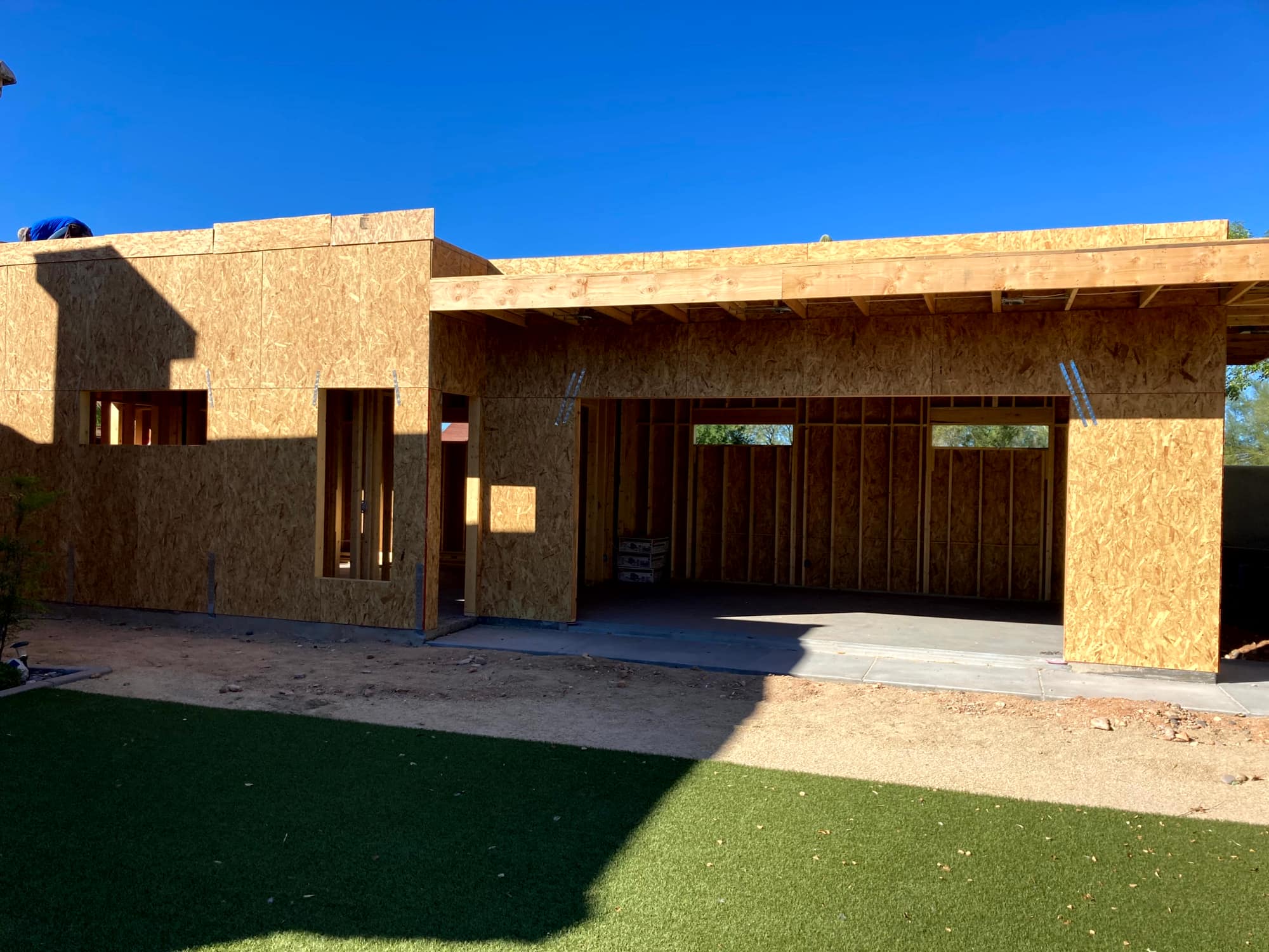 Casita walls sheathed in OSB, with the covered patio framed