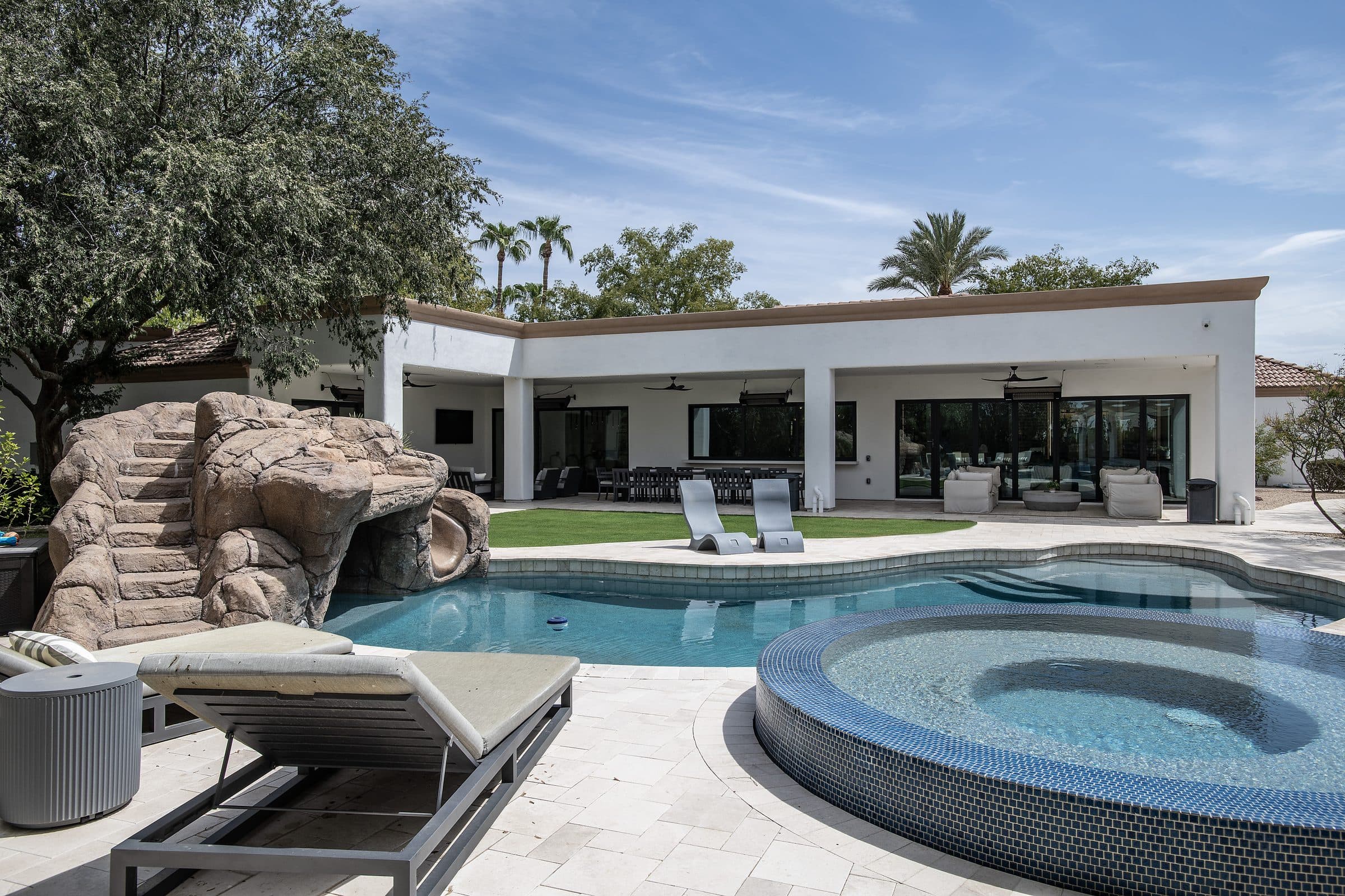 Pool, spa, and covered patio from an Apollo Builders Contemporary Mediterranean project